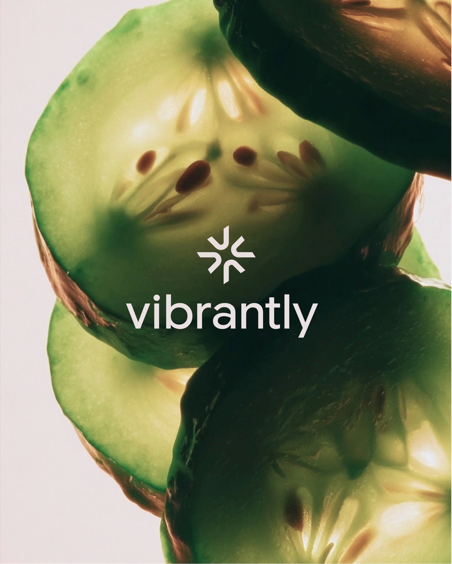 Vibrantly wordmark over a close-up of cucumber slices